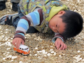 kid playing on coins